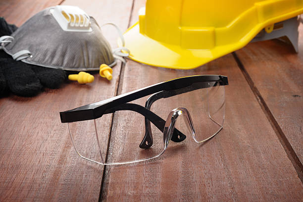 safety glasses on wooden plank